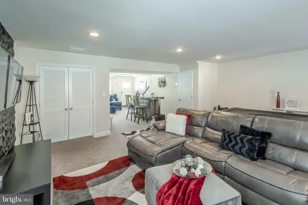 a living room with furniture and a rug