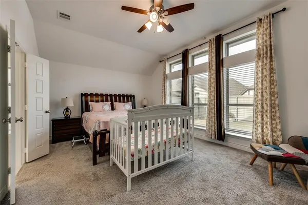 a bed room with a bed and a chandelier
