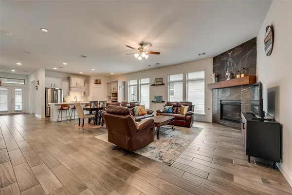a living room with furniture and a fireplace