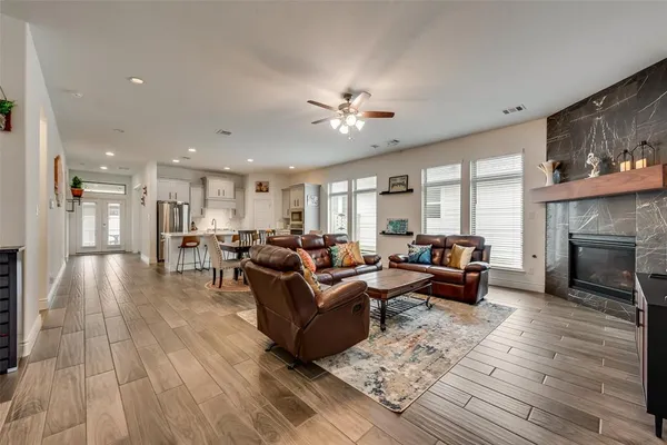 a living room with furniture and a fireplace
