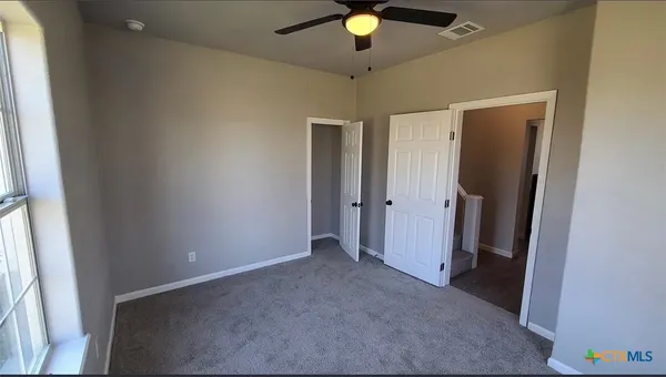 a view of an empty room with a window