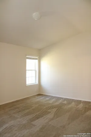 a view of an empty room and window