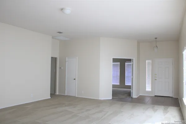 an empty room with closet area