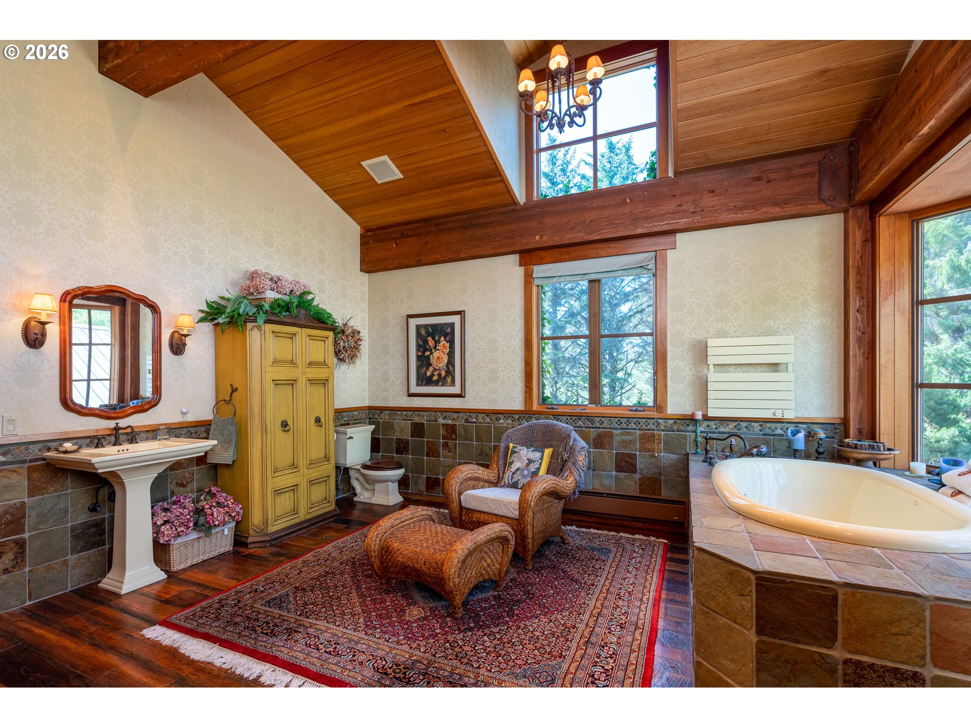 36044 Highway 101 Gold Beach, OR 97444 - Photo 22 of 43 a living room with furniture a fireplace and a large window