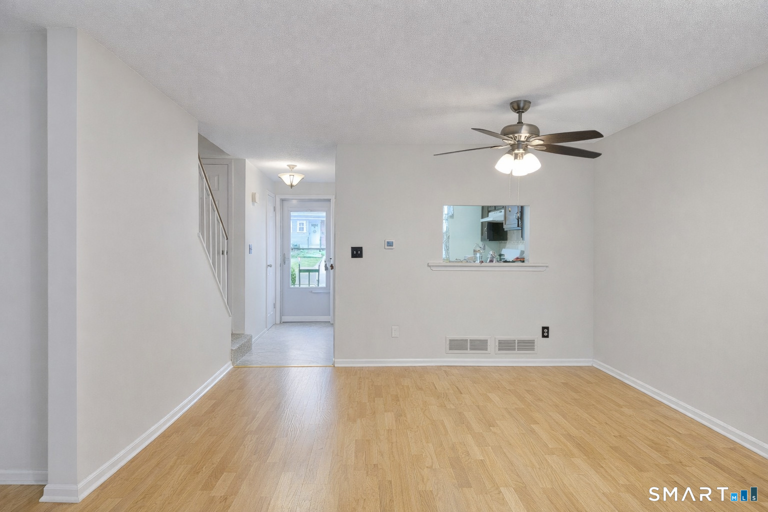 144 East Gate Lane, Unit 144 Hamden, CT 06514 - Photo 11 of 33 wooden floor in an empty room with a window