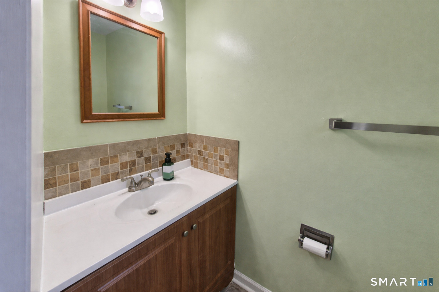 144 East Gate Lane, Unit 144 Hamden, CT 06514 - Photo 17 of 33 a bathroom with a sink and a mirror