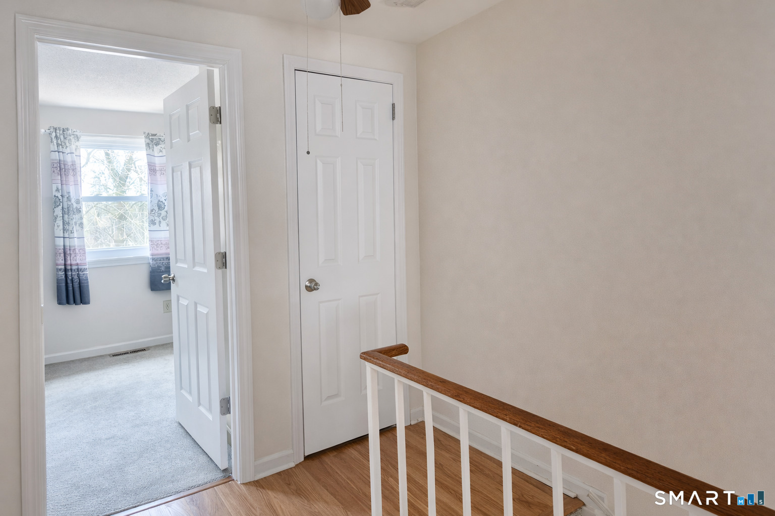 144 East Gate Lane, Unit 144 Hamden, CT 06514 - Photo 25 of 33 a view of a hallway with wooden floor and entryway