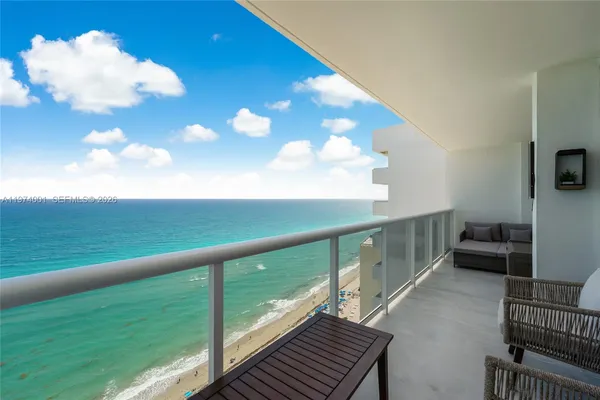 a view of balcony with furniture