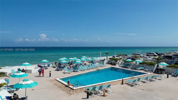 a room with lots of gym equipment and swimming pool
