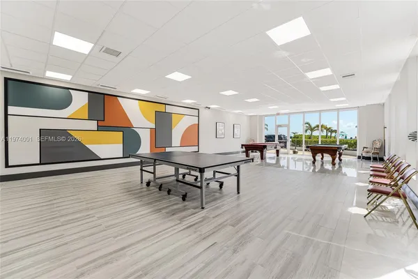 a lobby with furniture and wooden floor