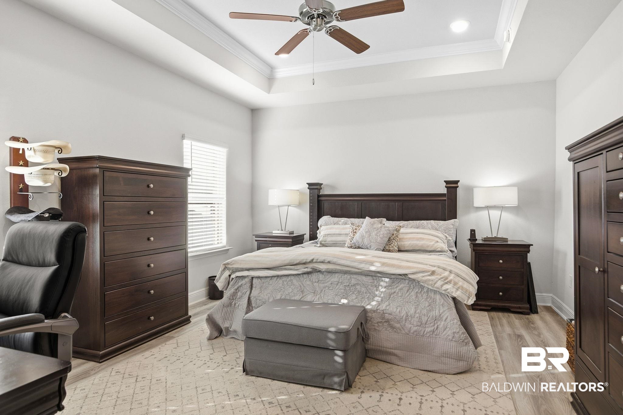 11123 Genuine Risk Circle Daphne, AL 36526 - Photo 25 of 67 Bedroom with crown molding, light wood-style flooring, and a ceiling fan