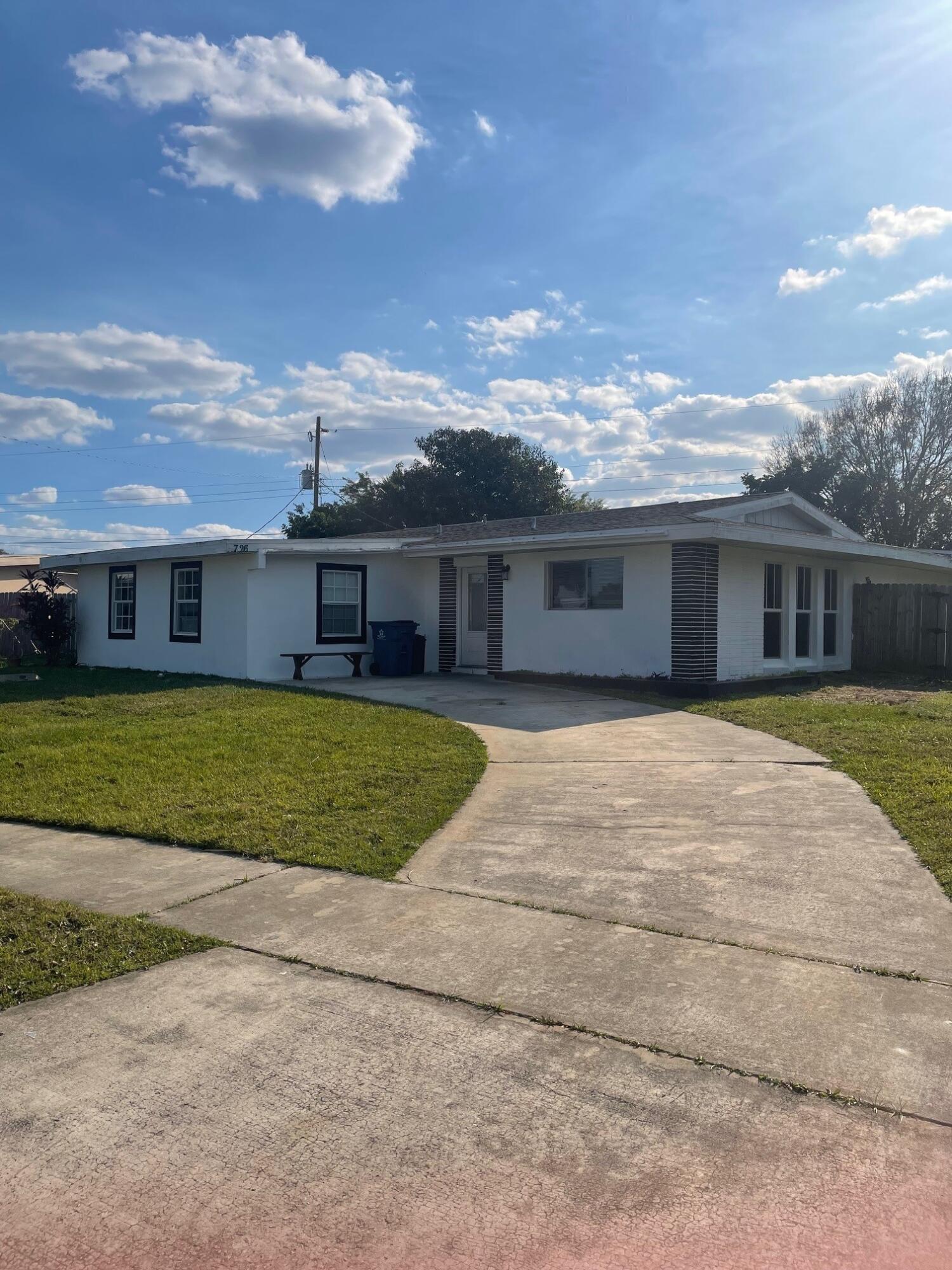 726 Atlanta Avenue Northeast Palm Bay, FL 32905 - Photo 1 of 1 a house view with a garden space