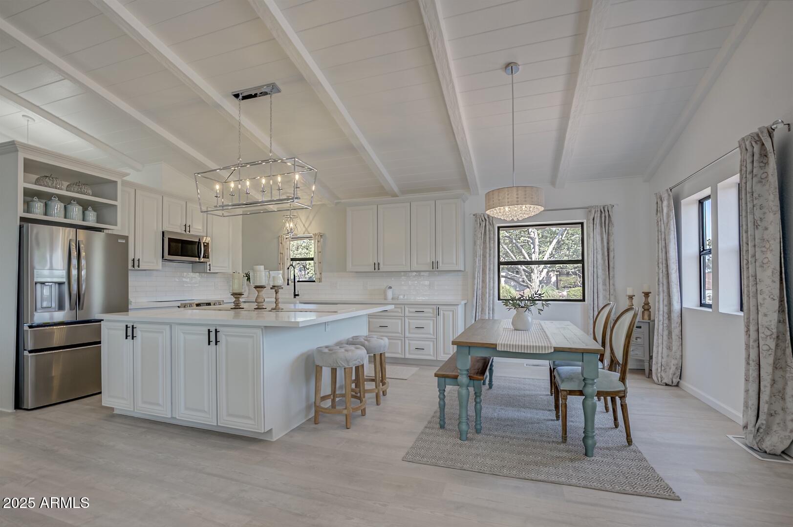 1303 North Sunshine Lane Payson, AZ 85541 - Photo 1 of 29 a kitchen with stainless steel appliances granite countertop a table chairs sink refrigerator and cabinets