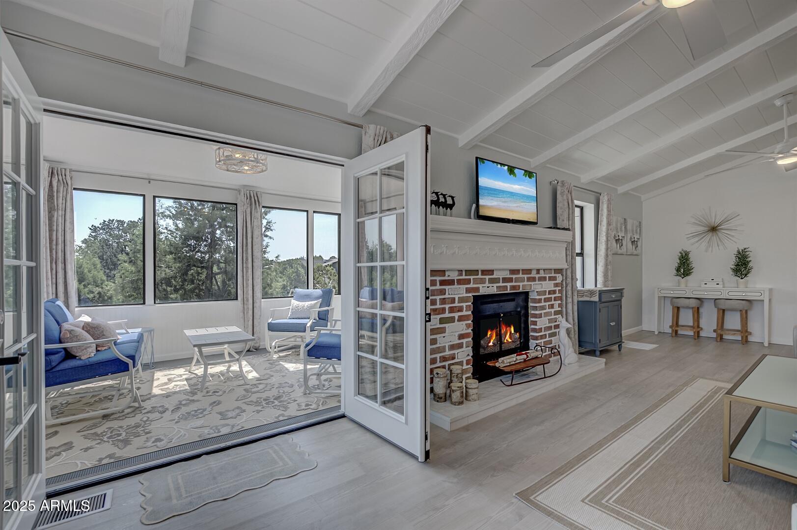 1303 North Sunshine Lane Payson, AZ 85541 - Photo 11 of 29 a living room with furniture and a fireplace