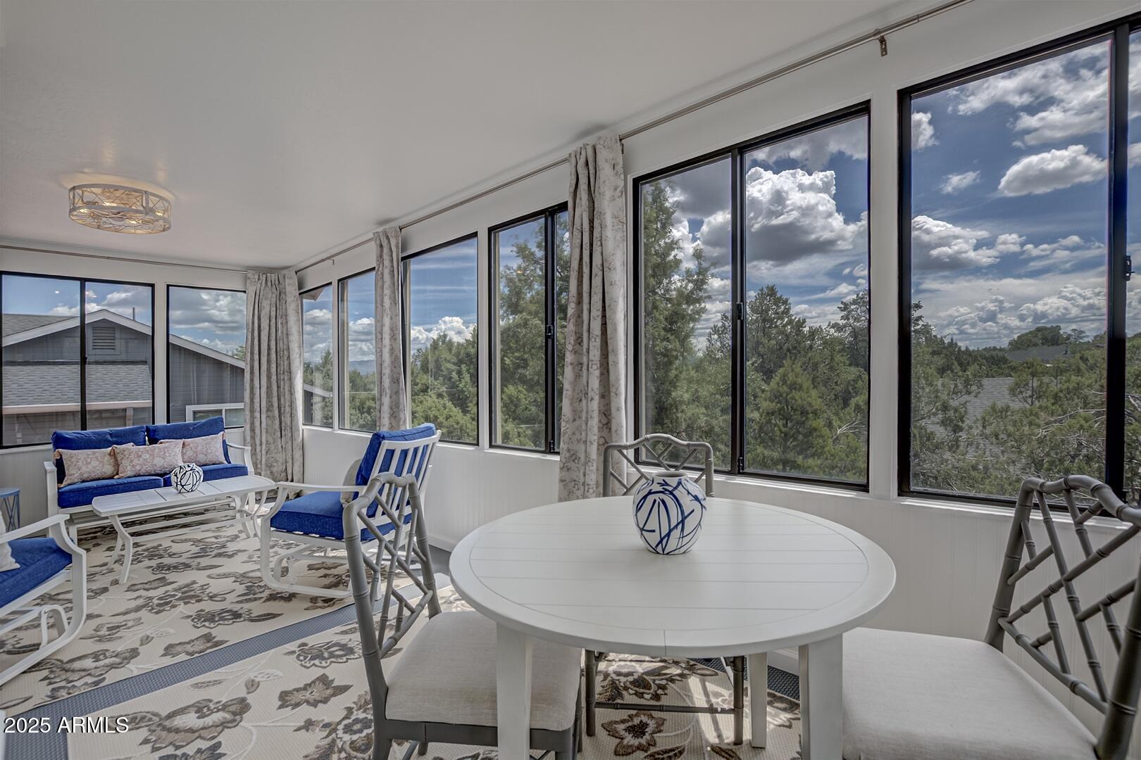 1303 North Sunshine Lane Payson, AZ 85541 - Photo 13 of 29 a dining room with furniture and large windows