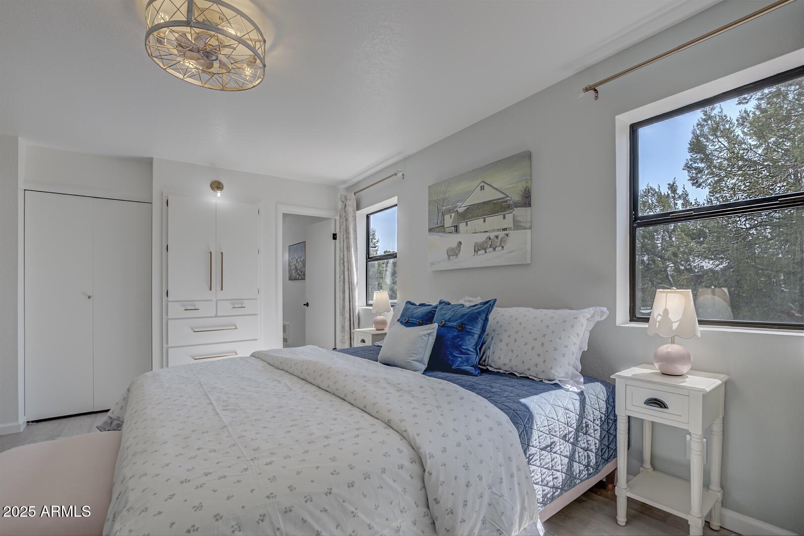 1303 North Sunshine Lane Payson, AZ 85541 - Photo 15 of 29 a bedroom with a large bed and a window