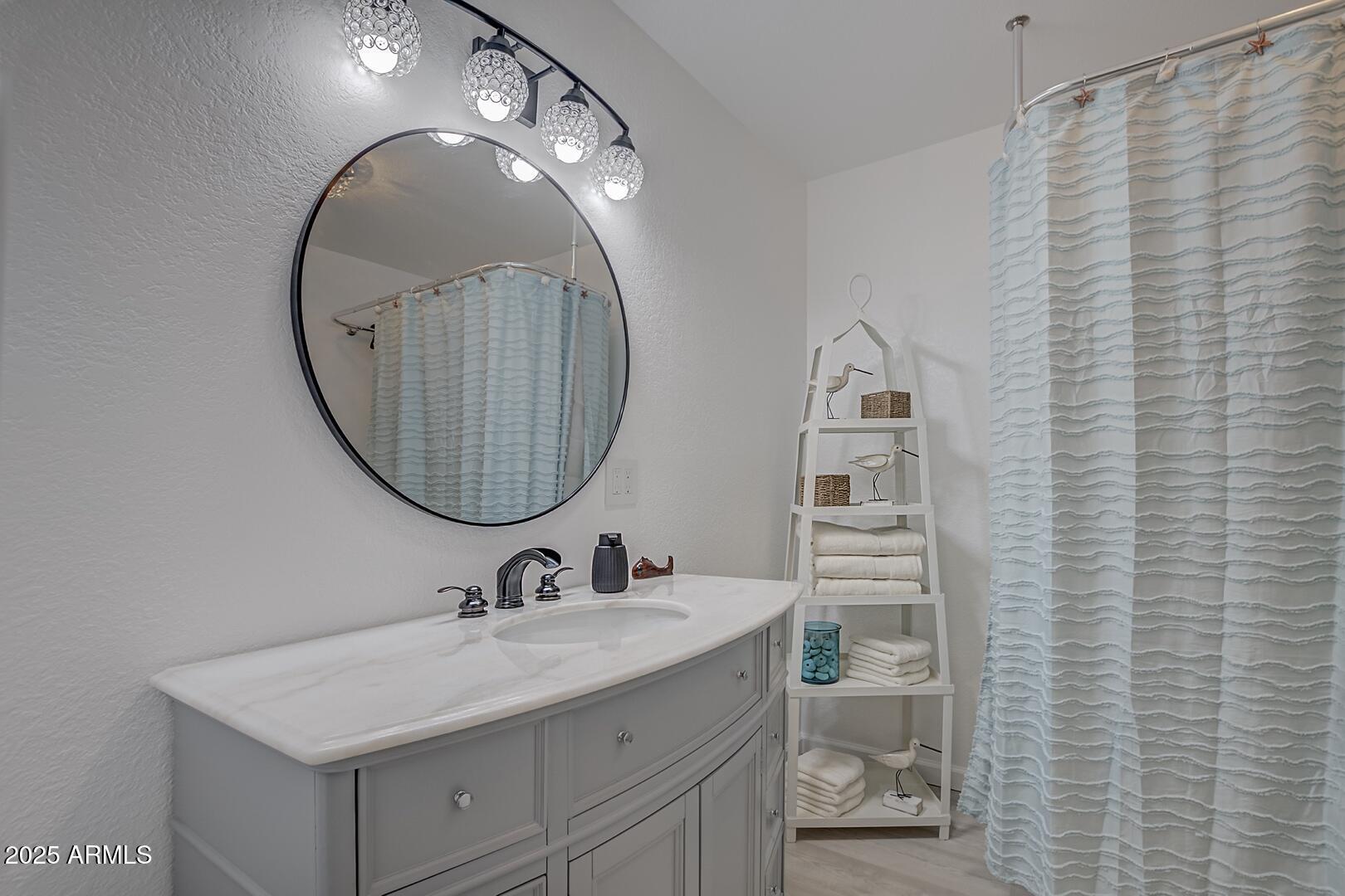 1303 North Sunshine Lane Payson, AZ 85541 - Photo 19 of 29 a bathroom with a sink a toilet and a mirror