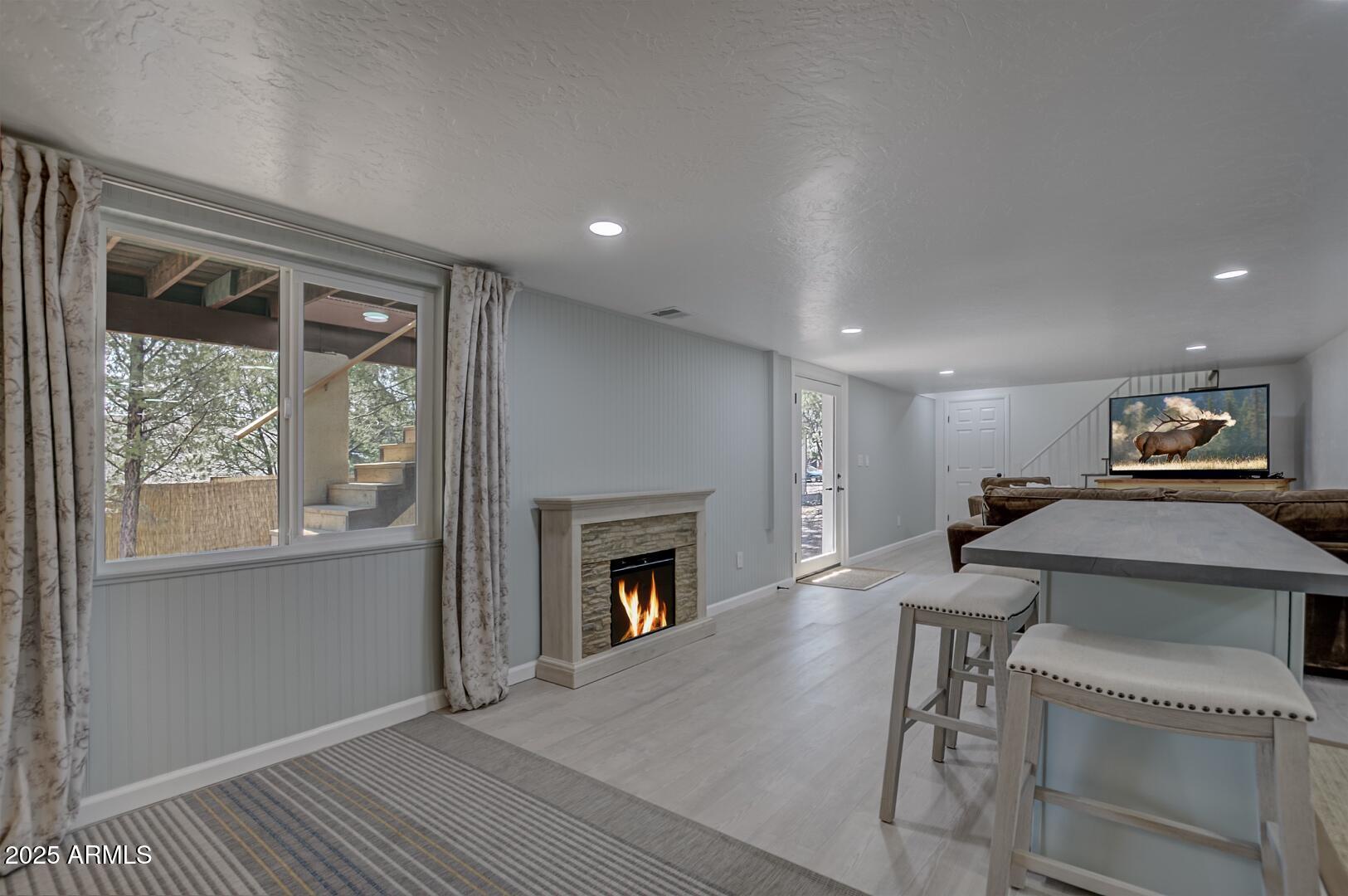 1303 North Sunshine Lane Payson, AZ 85541 - Photo 25 of 29 a living room with furniture and a fireplace
