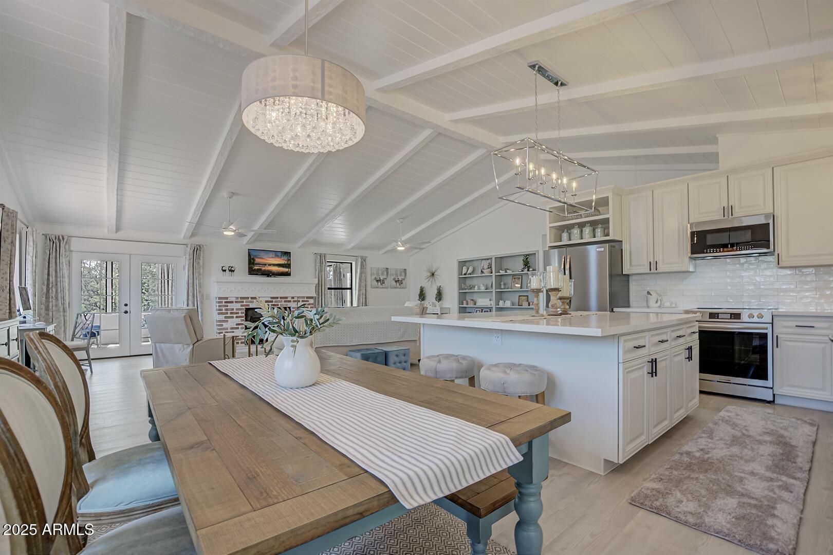 1303 North Sunshine Lane Payson, AZ 85541 - Photo 4 of 29 a large kitchen with a table and chairs