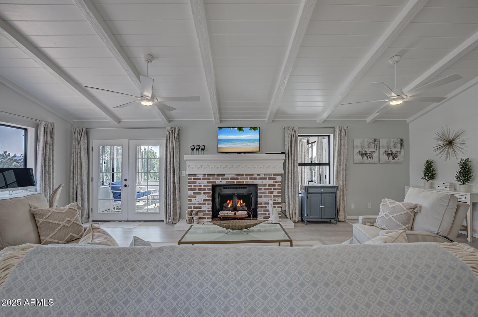 1303 North Sunshine Lane Payson, AZ 85541 - Photo 7 of 29 a living room with furniture and a fireplace