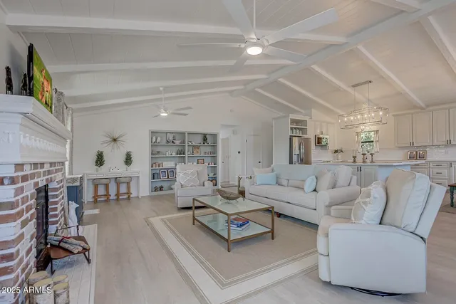 a living room with furniture and a table