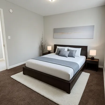 a bedroom with a bed and a night stand