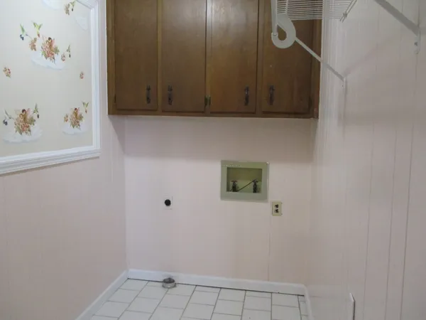 an empty room with closet and mirror