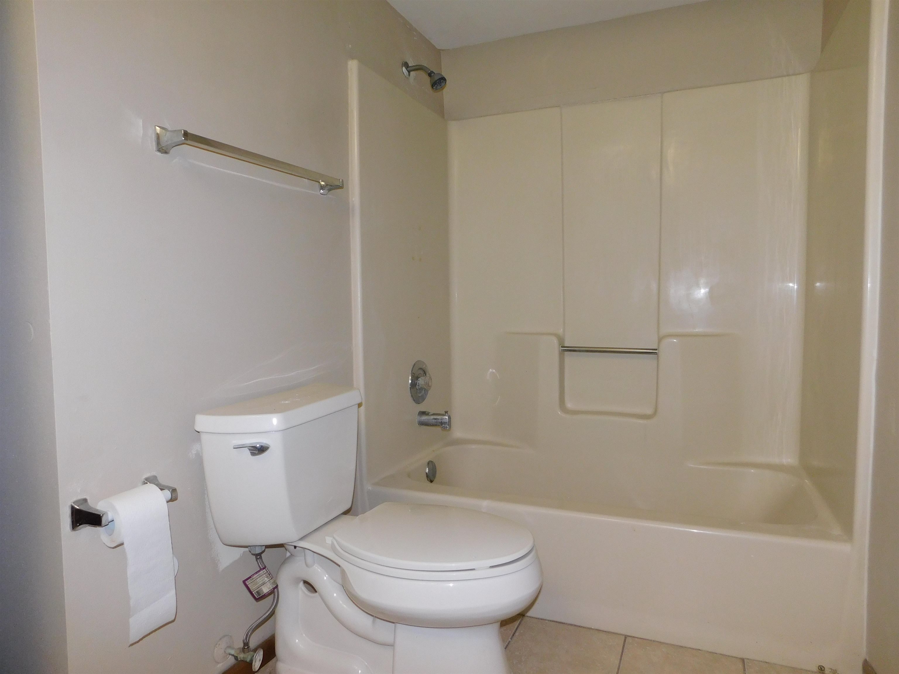 7329 Travertine Trail Rockford, IL 61107 - Photo 15 of 17 a bathroom with a sink a toilet and shower