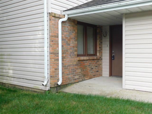7329 Travertine Trail Rockford, IL 61107 - Photo 2 of 17 a view of a back yard of the house