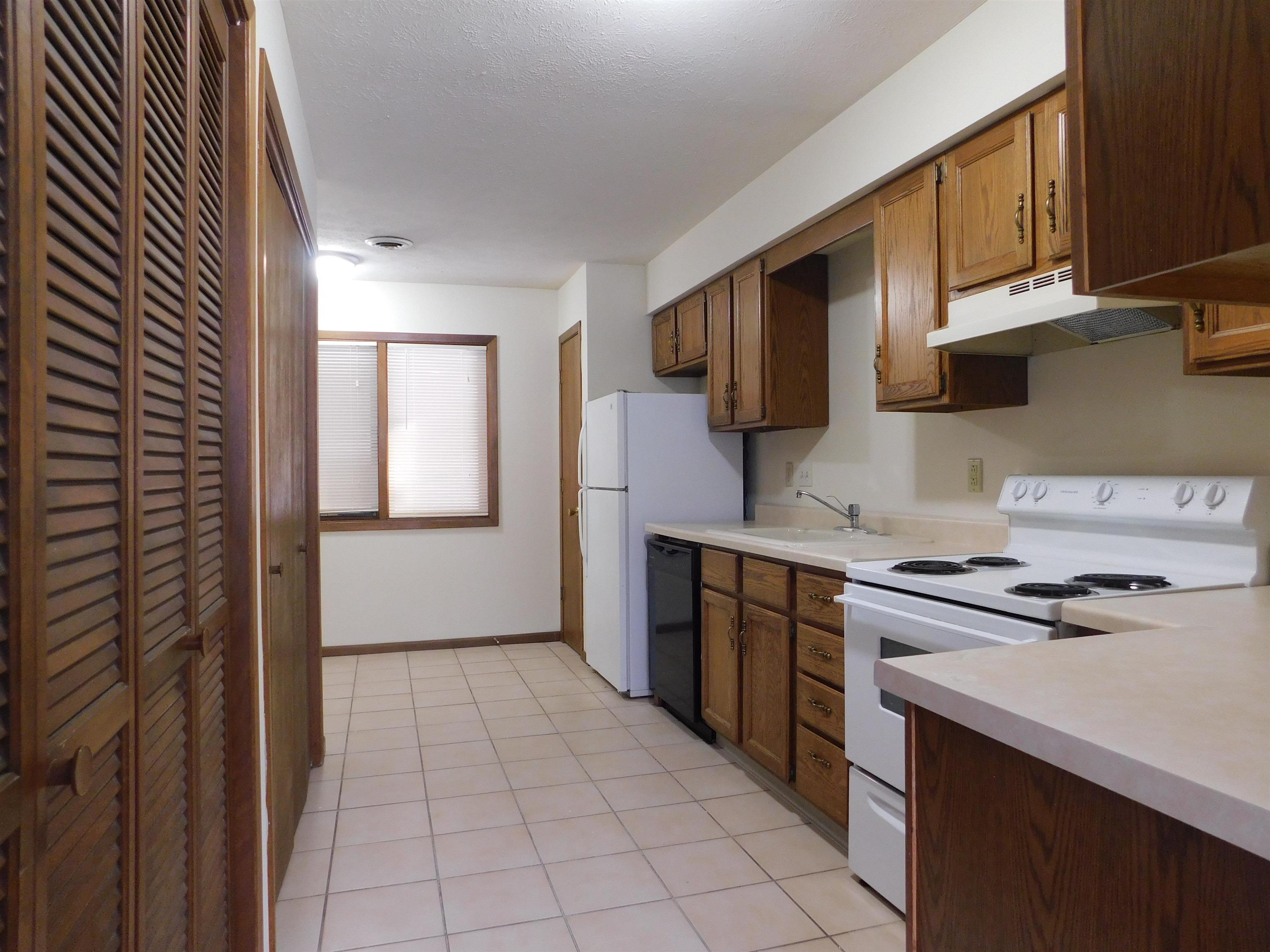 7329 Travertine Trail Rockford, IL 61107 - Photo 9 of 17 a kitchen with a stove top oven sink and cabinets