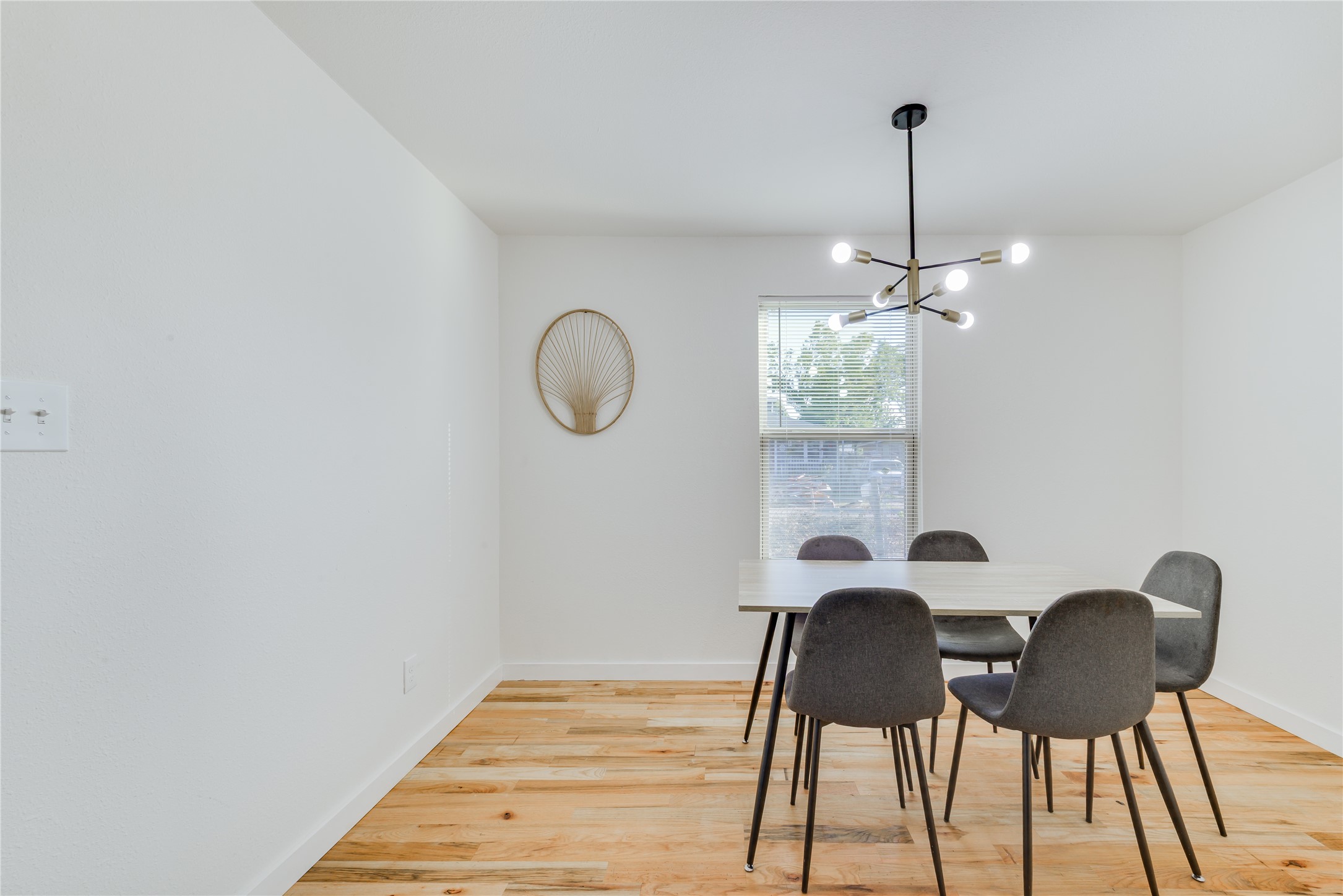 6603 Victoria Street Houston, TX 77020 - Photo 12 of 34 a view of a dining room with furniture wooden floor and chandelier
