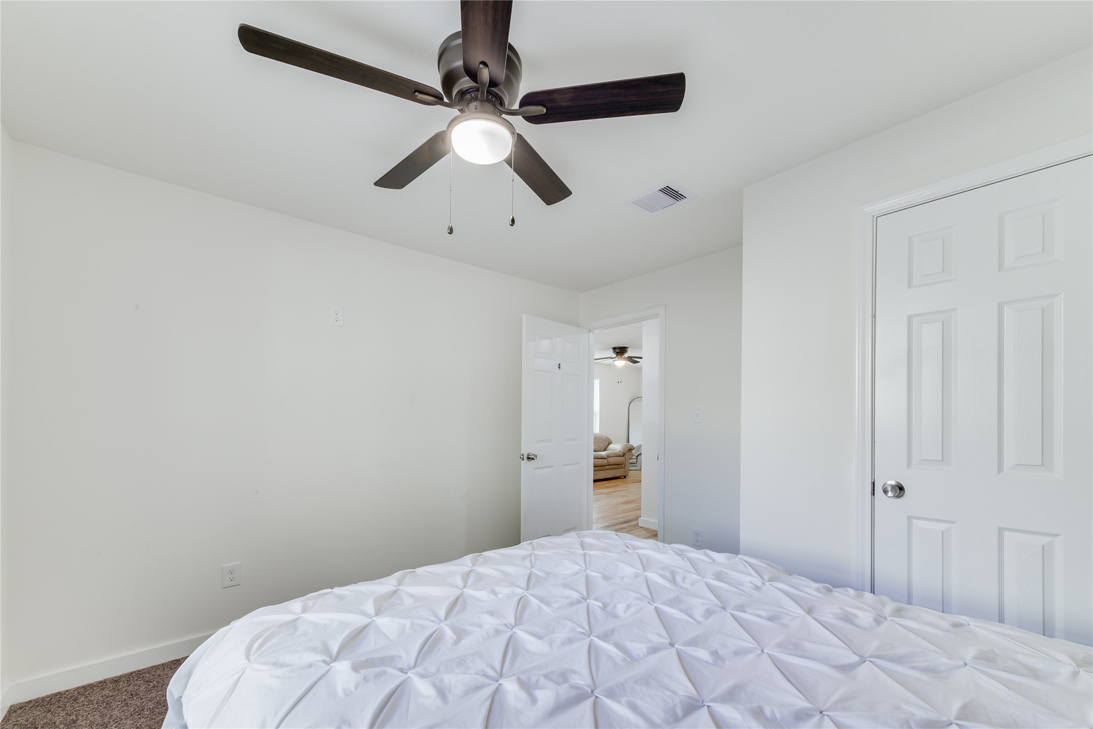 6603 Victoria Street Houston, TX 77020 - Photo 16 of 34 a bedroom with a bed and a chandelier