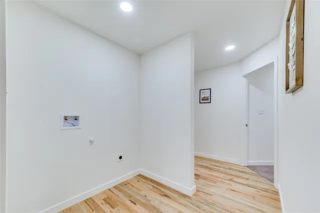 a view of room with wooden floor