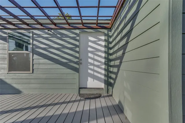 a view of a balcony with wooden floor