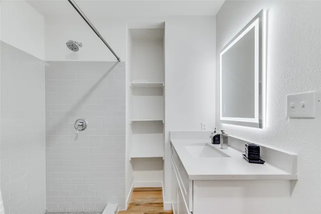 a bathroom with a sink and a mirror