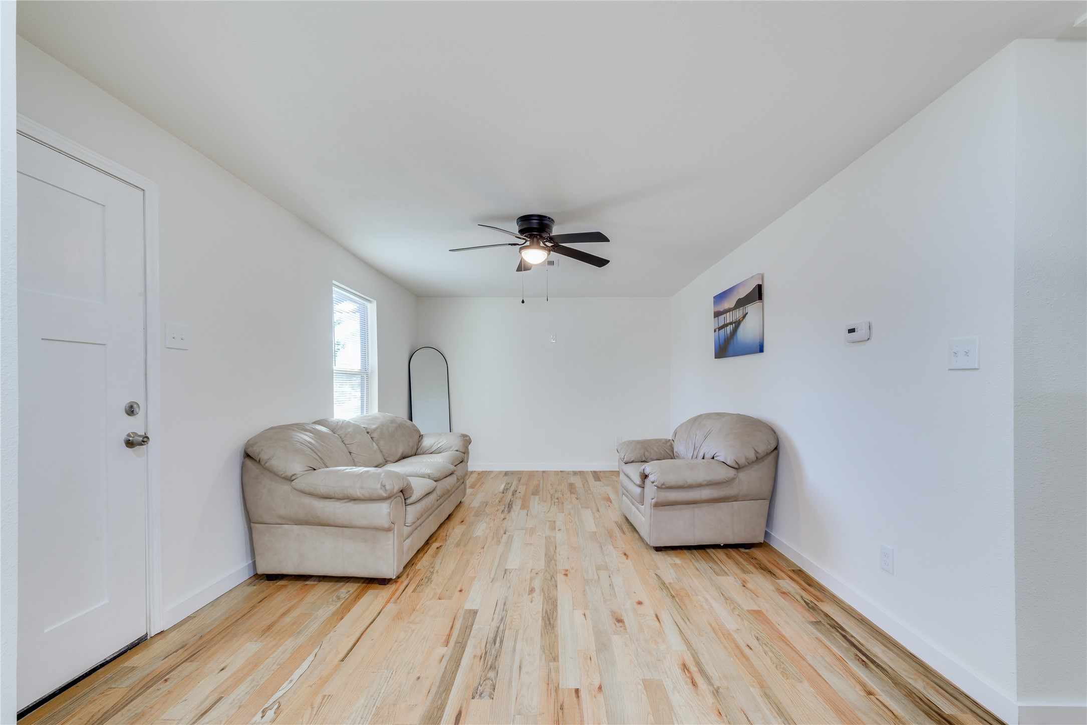 6603 Victoria Street Houston, TX 77020 - Photo 6 of 34 a living room with furniture and a wooden floor