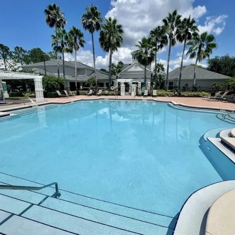 a view of a swimming pool with a patio