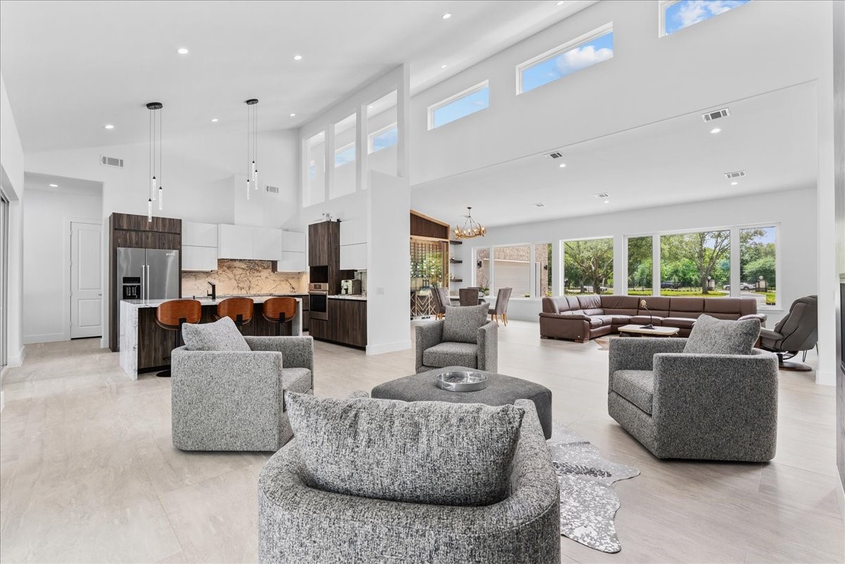 7627 Scott Avenue Manvel, TX 77578 - Photo 13 of 50 This light-filled great room offers a perfect blend of modern warmth and entertaining on a grand-scale design.