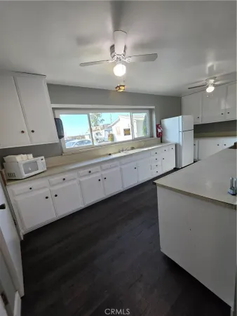 a kitchen with counter top space and cabinets