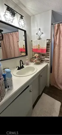 a bathroom with a sink double vanity and a mirror