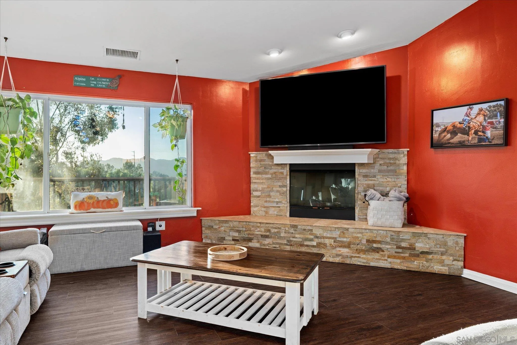 1714 Foss Road Alpine, CA 91901 - Photo 13 of 66 a living room with furniture a flat screen tv and a fireplace