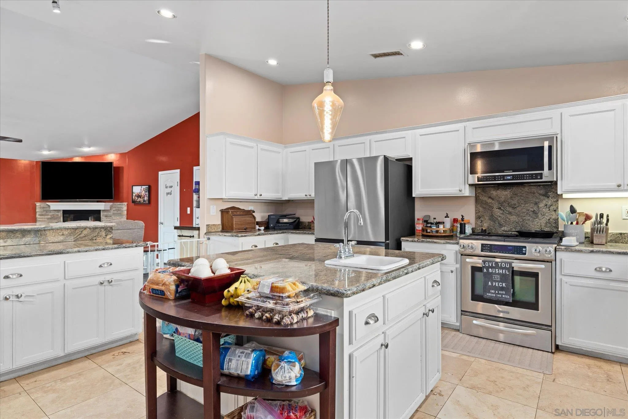 1714 Foss Road Alpine, CA 91901 - Photo 18 of 66 a kitchen with stainless steel appliances granite countertop a stove refrigerator sink and cabinets