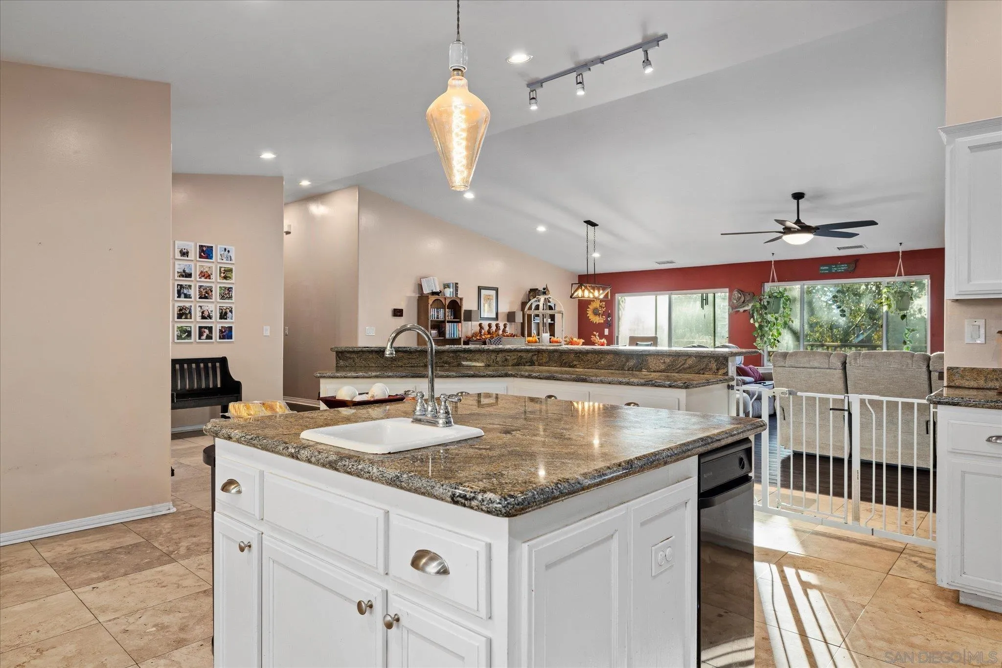 1714 Foss Road Alpine, CA 91901 - Photo 20 of 66 a kitchen with stainless steel appliances granite countertop a sink a counter space and a view of living room