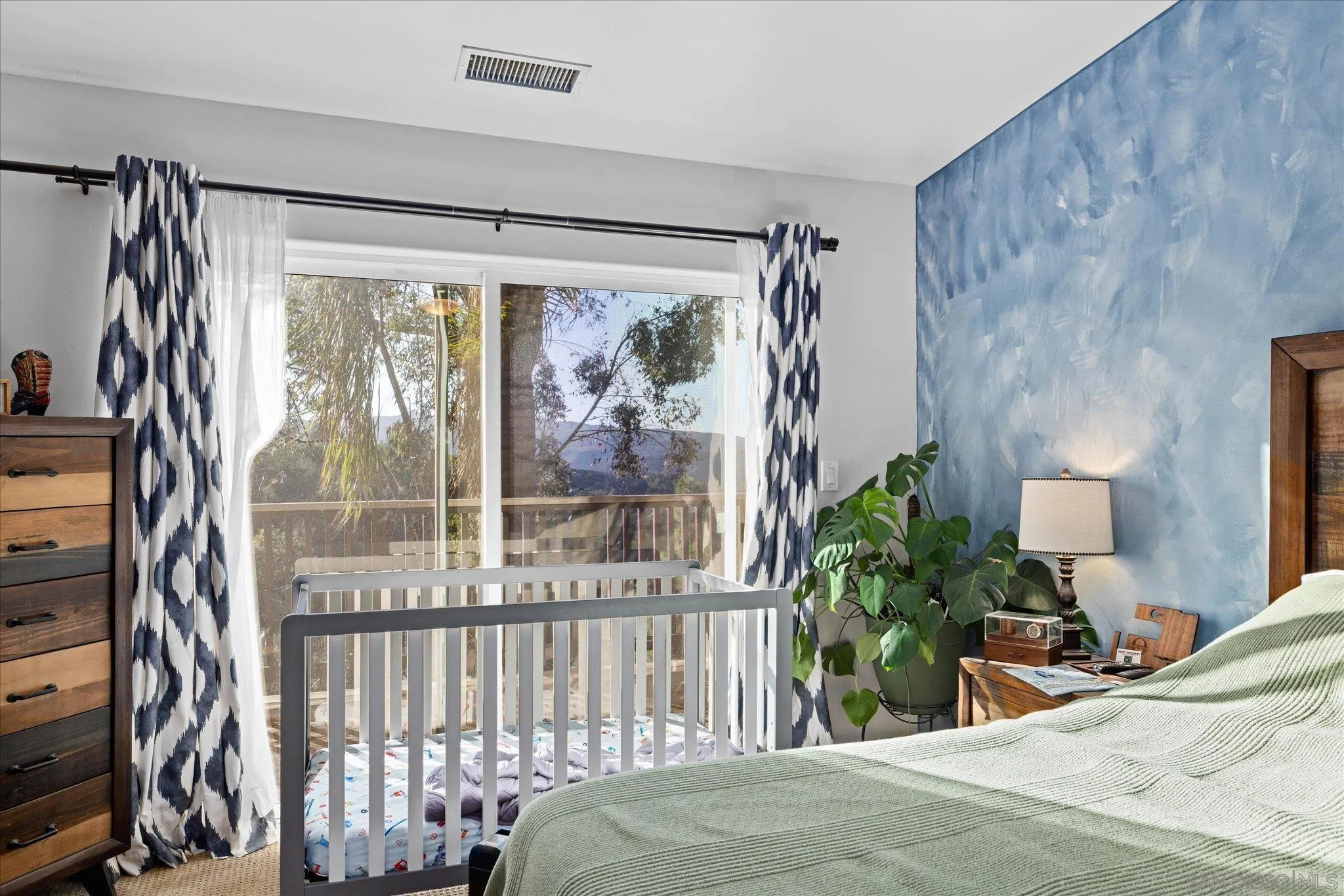 1714 Foss Road Alpine, CA 91901 - Photo 24 of 66 a bedroom with a bed and a painting on the wall