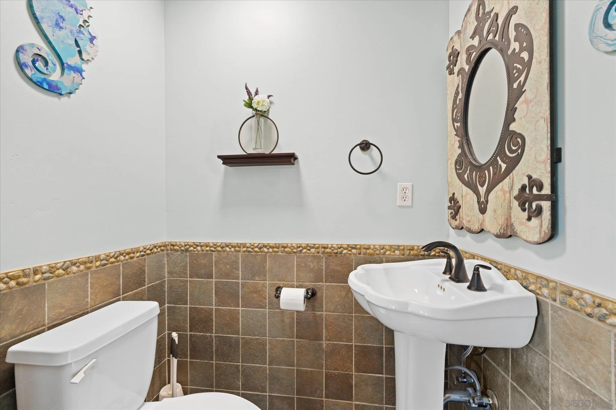 1714 Foss Road Alpine, CA 91901 - Photo 38 of 66 a bathroom with a sink a toilet and mirror