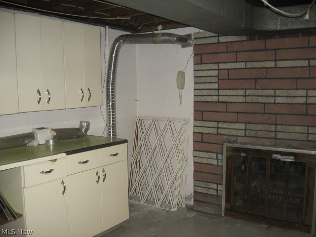 2923 Shellhart Road Barberton, OH 44203 - Photo 12 of 15 work room connects to finished rec room area has fireplace
