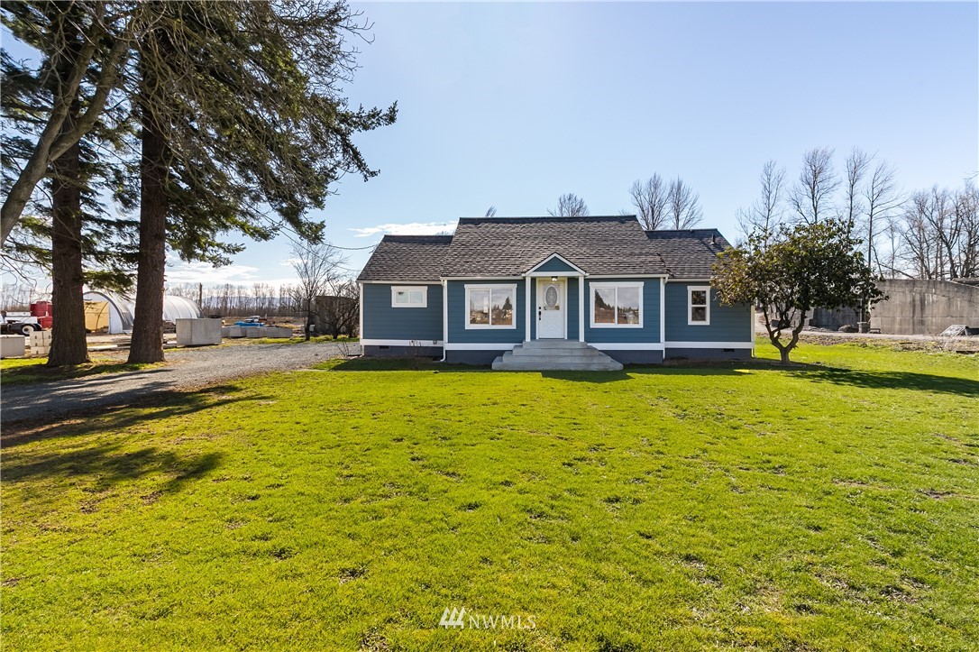 1077 Hampton Road Lynden, WA 98264 - Photo 2 of 25 a front view of a house with swimming pool