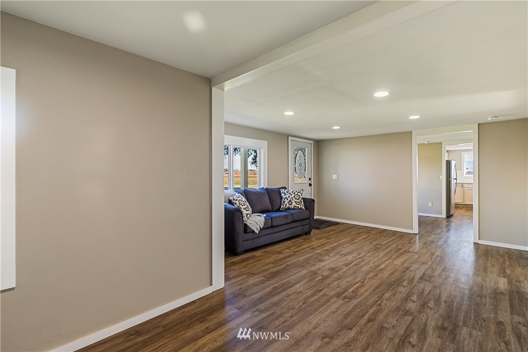 1077 Hampton Road Lynden, WA 98264 - Photo 5 of 25 a living room with furniture and a wooden floor