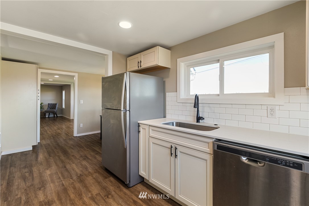 1077 Hampton Road Lynden, WA 98264 - Photo 7 of 25 a kitchen with a sink appliances and cabinets