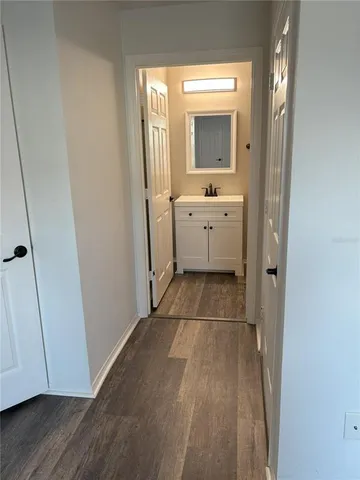 a bathroom with a sink a mirror and a toilet